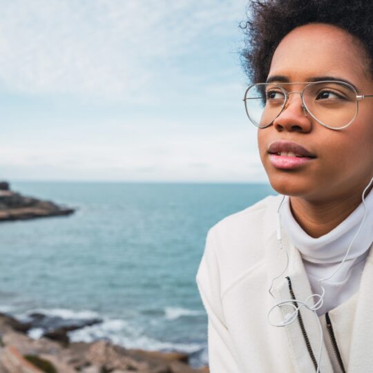 Woman listening to music with earphones.