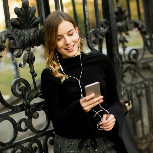 Young woman listening music outdoor